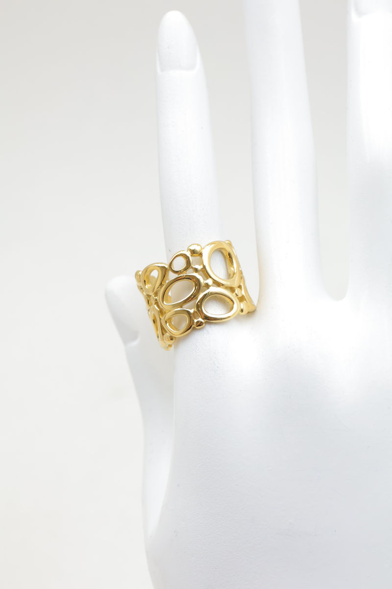 Anillo ancho ajustable de acero inoxidable con patrones geométricos ovalados y redondos calados