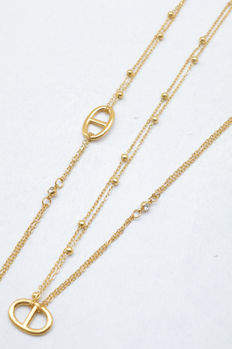 Schmuckset aus edelstahl mit einer doppelreihigen halskette und einem doppelsträngigen armband mit ankerkettenmuster, perlen und Strass