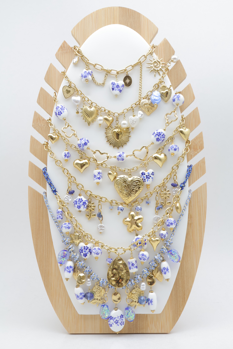 Set of 7 charm necklaces with heart, star and enamelled floral beads