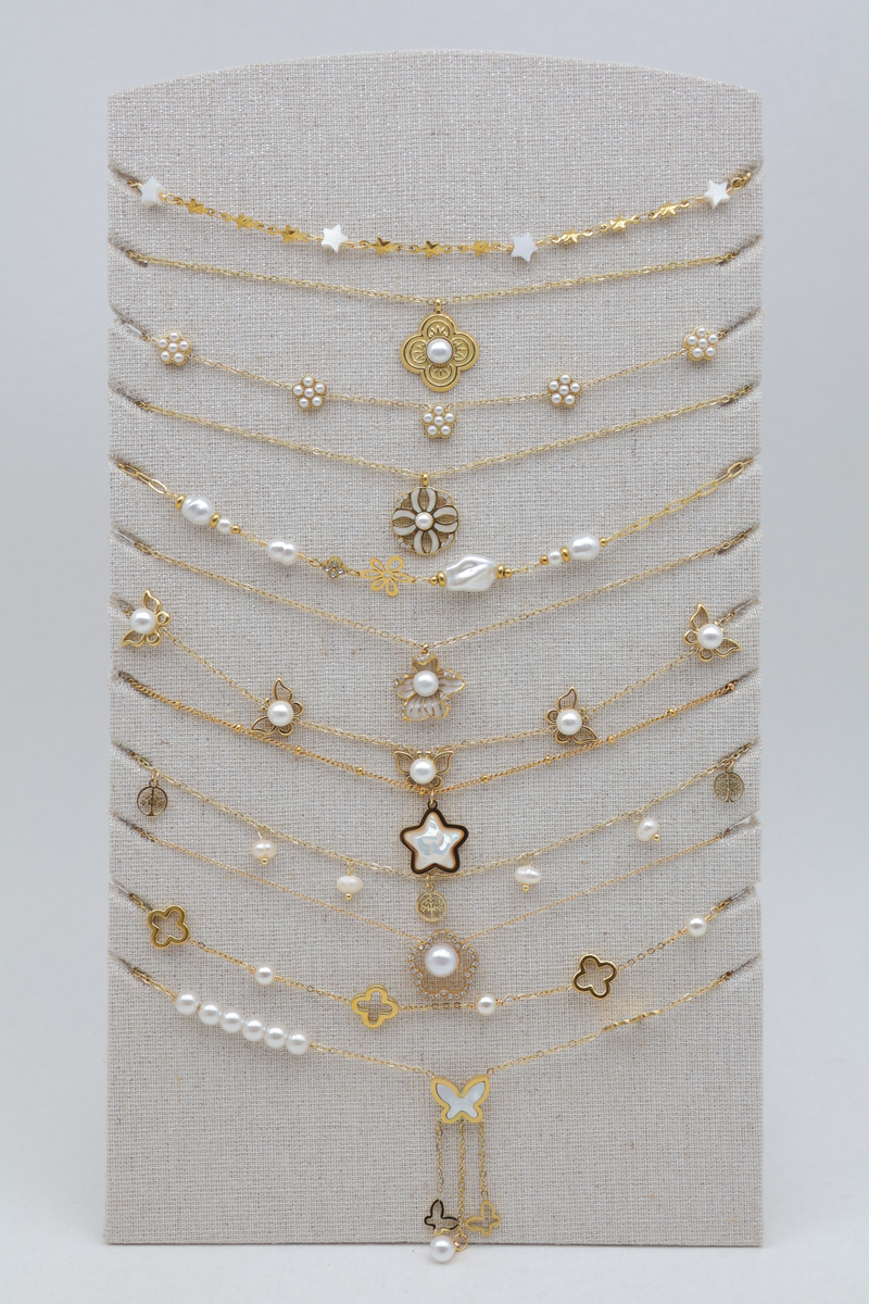 Set of 12 thin necklaces with mixed charms