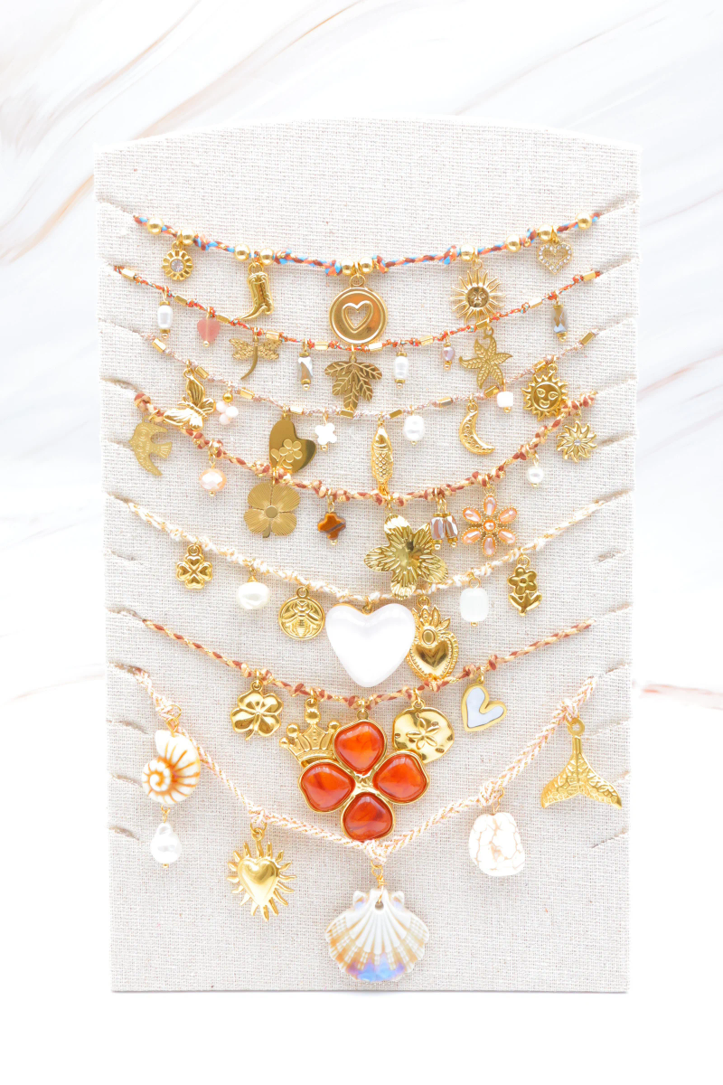 Set of 7 stainless steel necklaces with display stand