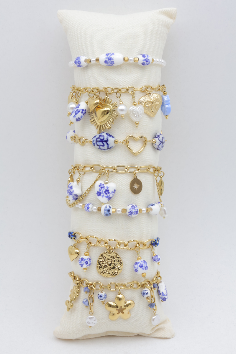 Set of 7 charm bracelets with heart, star and enamelled floral beads
