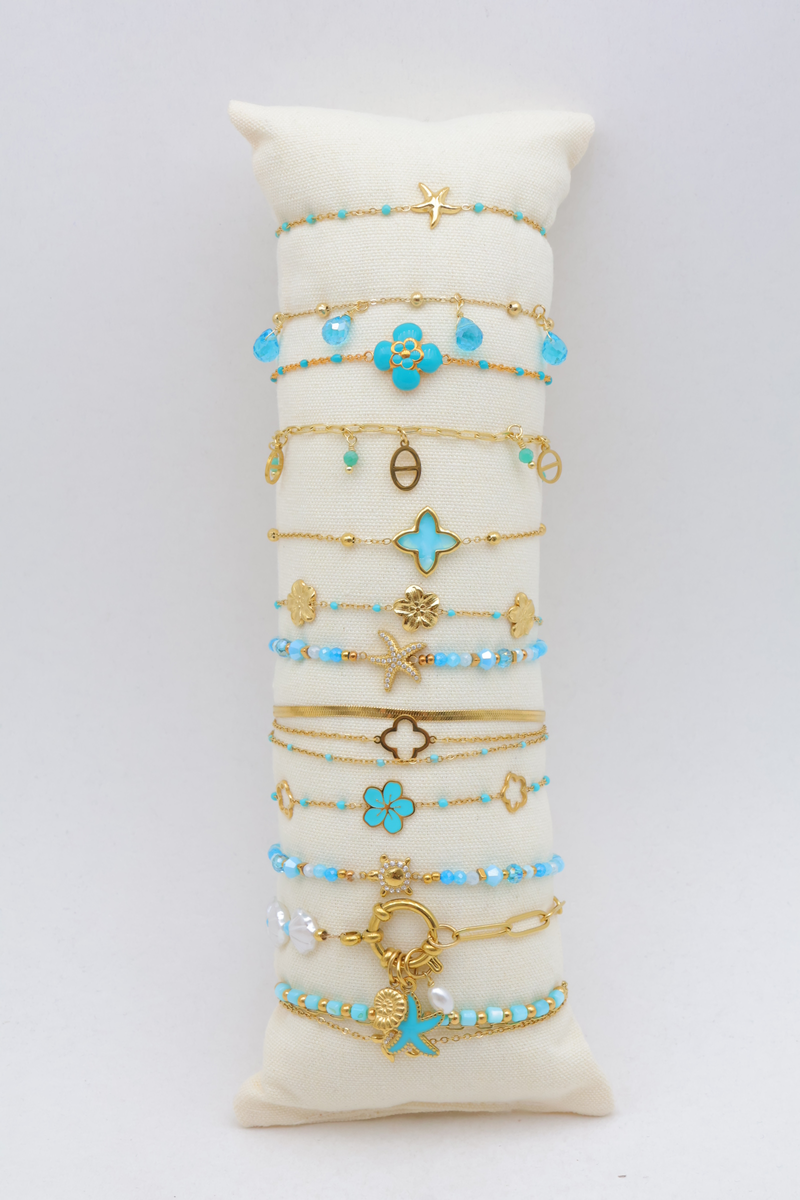 Set of 12 enamelled bracelets on cushion display