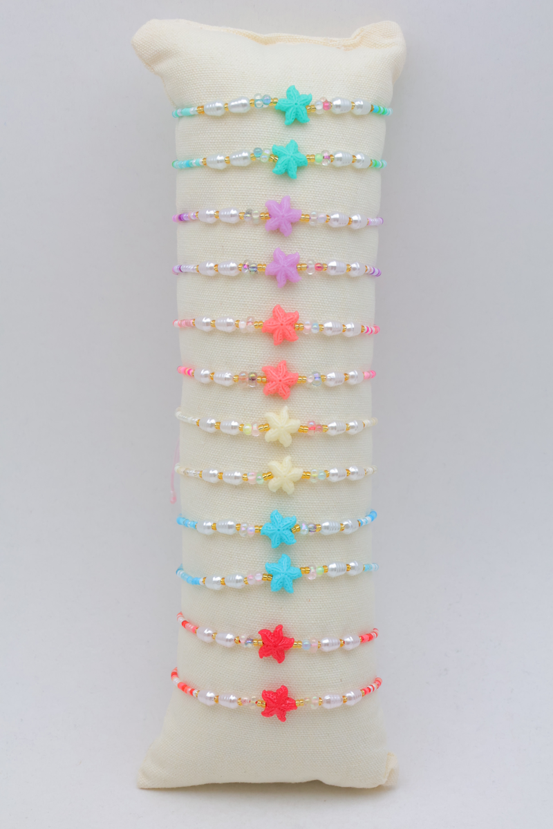 Set of 12 small cushions, each containing a set of 3 matching stainless steel bracelets, with a wooden tray — Multicolor