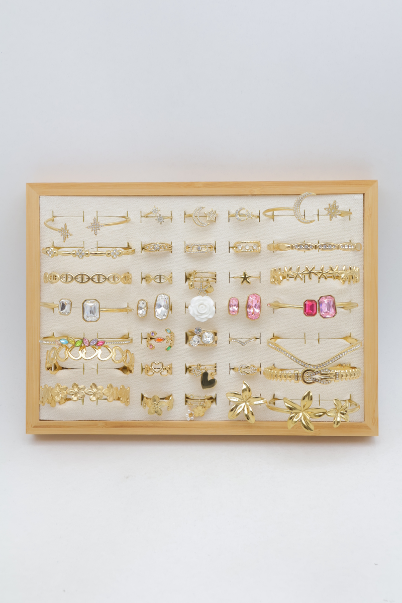 Assortment of 21 rings and 14 bangles with star, heart and flower motifs